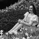CIRCA 1950s: Portrait of woman surrounding by flowers. (Photo by George Marks/Retrofile/Getty Images)